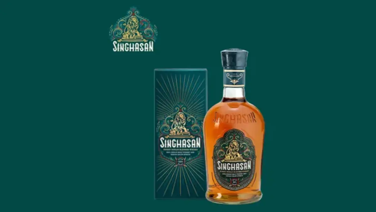 Singhasan Whisky bottle showcasing premium packaging and rich golden hue, launched by Modi Illva India to redefine India's premium whisky segment.